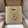 0ba809a0-afec-4d2e-a97f-3aafcce5feae.webp Crystal Purple Heart Pendant Gold Chain Necklace