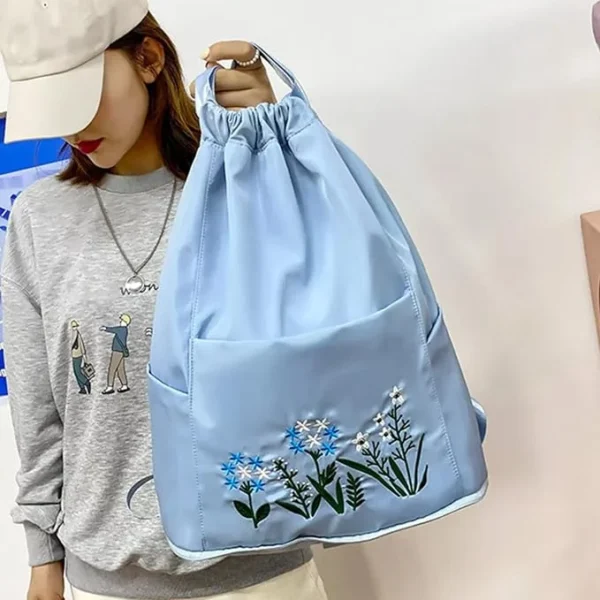 adccddf2-528d-4eb2-b739-9484e5b67527.webp Floral Embroidery Drawstring Backpack for Women